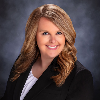 Photo of Director of Marketing Erin Lawrence in a suit