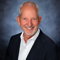 Kurt in a suit and tie