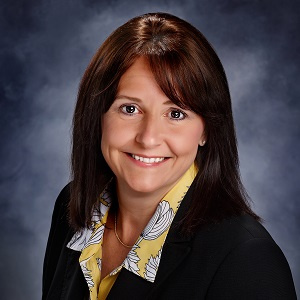 Whitney Morrow of Treasury Management in a suit