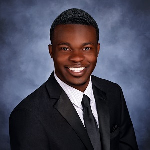 Tre Price in a suit and tie