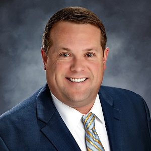 Adam O'Sullivan of Commerical Lending in a suit and tie